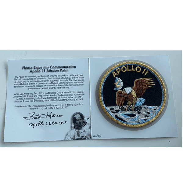 An Approach & Landing Patch autographed by Fred Haise with an eagle on it.