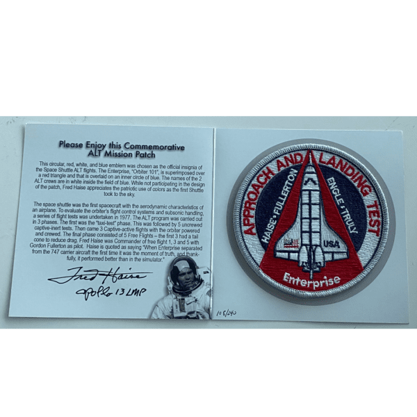 A Approach & Landing Patch autographed by Fred Haise with a nasa logo on it.