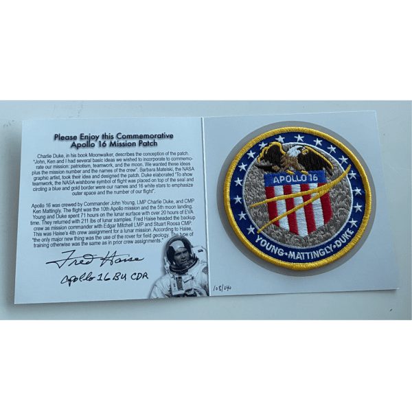 The Approach & Landing Patch autographed by Fred Haise with an American eagle on it.